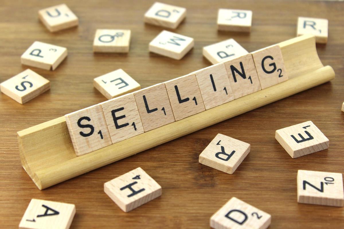 A set of lettered tiles spelling the word "Selling".